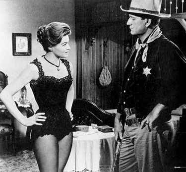 Джон Уэйн (John Wayne) и Энджи Диккинсон (Angie Dickinson) в фильме 'Рио Браво'/'Rio Bravo' (1959)